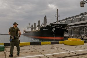 A Ukrainain soldier near grain silos during a meeting of G7 representatives, at the Odesa Port in Ukraine, July 29, 2022. (Daniel Berehulak/The New York Times)