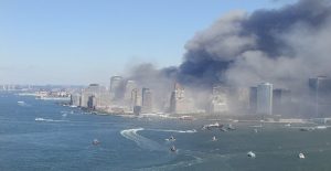 Boats approach the Lower Manhattan waterfront to provide assistance