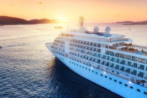 Aerial view at the cruise ship during sunset. Adventure and trav