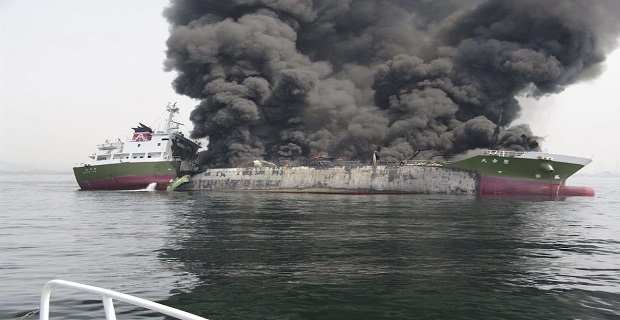 Smoke rises from the 998-tonne fuel tanker Shoko Maru after it exploded off the coast of Himeji