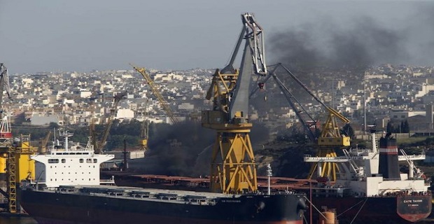 Thick black smoke rises from the deck of the Liberia-registered bulk carrier Cape Tavor at the Palumbo dockyard in Valletta's Grand Harbour