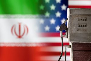 Illustration shows model of petrol pump, U.S. and Iran flag colors