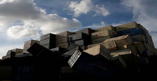 Birds fly over the toppled shipping containers after Typhoon Meranti made landfall, in Kaohsiung