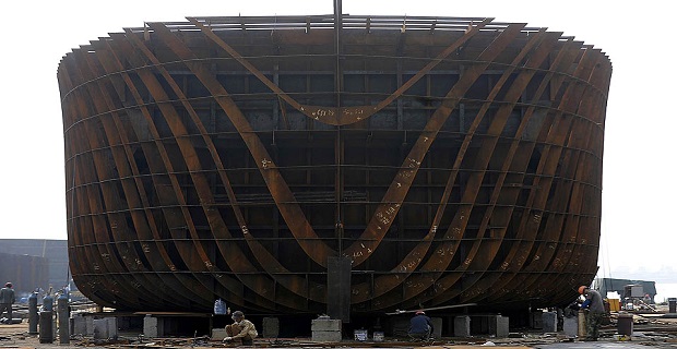 Employees work at a shipbuilding factory in Wuwei county