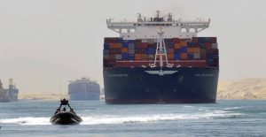 A cargo ship is seen crossing through the New Suez Canal