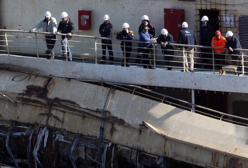 The captain of the Costa Concordia, Francesco Schettino, stands on the Costa Concordia cruise liner at the Giglio harbour