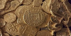 Handout photo of gold coins and gold chain found in the wreckage of a 1715 Spanish fleet that sunk in the Atlantic
