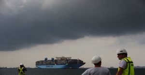 The MV Maersk Mc-Kinney Moller is led by pilot ships as it makes its maiden port of call at a PSA International port terminal in Singapore