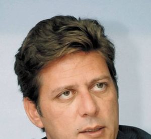 An aerial view shows the Costa Concordia as it lies on its side next to Giglio Island taken from an Italian navy helicopter